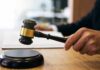 Judges Nuke NYC Privacy Overreach Judge's hand holding a gavel over a sound block
