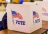 Vouching Rule Ignites Election Integrity Fight voting booth with American flag graphics