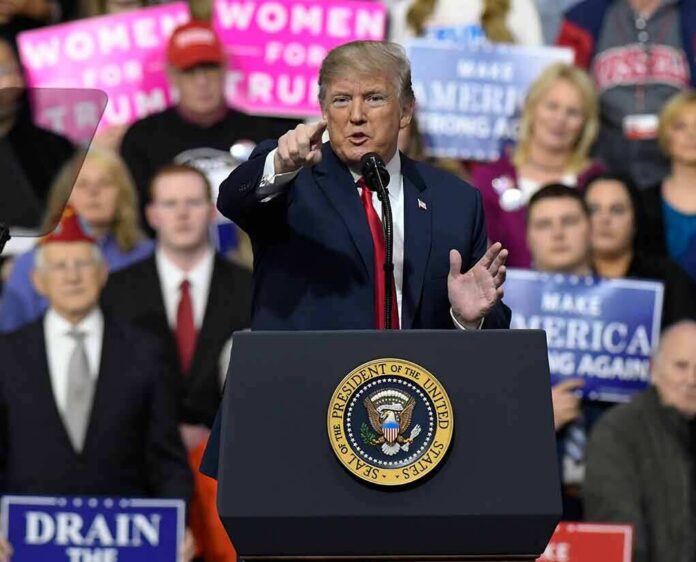 shutterstock_1046190946 politician speaking at a rally podium