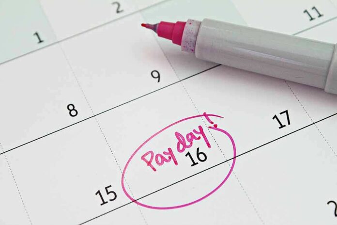 shutterstock_1095971432 Calendar with pink marker circling the 16th