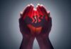 Stigma Surge Muzzles Abortion Debate Hands cupping a glowing fetal silhouette
