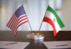 Trump Halts Iran Talks — Markets Brace United States and Iran desk flags on a stand