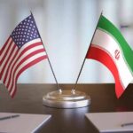 Trump Halts Iran Talks — Markets Brace United States and Iran desk flags on a stand