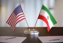 Trump Halts Iran Talks — Markets Brace United States and Iran desk flags on a stand