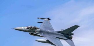 Fighter jet banking in the sky