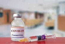 Hiding Numbers? CDC’s COVID Debate Leaks vaccine vial and syringe on a counter in a clinic