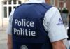 Anonymous Tip Stops Preschool Carnage Plan Police officer in uniform seen from the back
