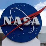 Space Medal Bombshell Drops in Houston NASA logo on a large blue circular sign