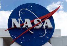 Space Medal Bombshell Drops in Houston NASA logo on a large blue circular sign