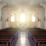 Shanghai Crackdown Reaches Church Aisles Empty church interior with sunlight at the altar
