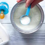 Bathtub Horror Sparks Forensic Whiplash Baby formula powder in a can with a blue scoop