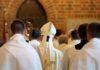 Church Civil War Erupts Over Divorce Bishop in white mitre among clergy during church procession