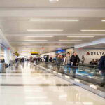 Court Shocker Ends Airport Stop-And-Frisk Airport terminal with passengers on a moving walkway