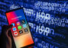 Smartphone showing social media apps with text background.