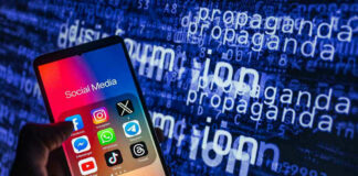 Smartphone showing social media apps with text background.