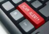Government Email Trap Exposes Revolut Records Keyboard with red scam alert key