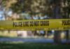 Governor Ducks As Campus Murder Explodes yellow police tape cordoning off an outdoor area