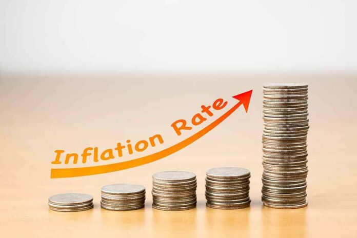 shutterstock_1020792091 stacks of coins increasing with upward arrow