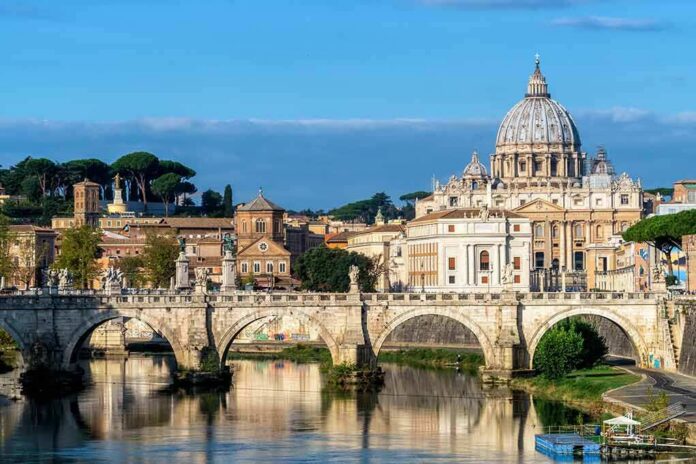 St. Peter's Basilica behind Ponte Sant'Angelo over the Tiber River