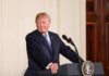 Trump Courts Latino Vote – What’s The Angle? man at podium with presidential seal
