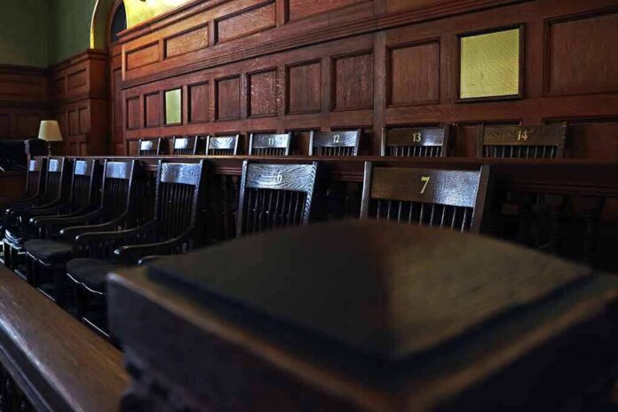 shutterstock_1132288550 Empty wooden jury box with numbered chairs