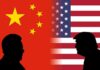 Silhouetted leaders facing off before China and United States flags