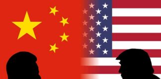 Silhouetted leaders facing off before China and United States flags