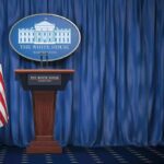 Space Academy Gambit Rattles Congress White House press briefing podium with U.S. flag and blue curtain