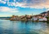 Bab el-Mandeb Jitters After Shocking Port Grab Coastal town with waterfront houses and a historic fortress