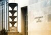 DOJ Gambit Sparks Supreme Court Clash Department of Justice building exterior with sign and metal sculpture