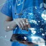 Aging Boom Fuels Massive Job Shift Healthcare professional using a digital tablet with medical data icons