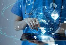 Aging Boom Fuels Massive Job Shift Healthcare professional using a digital tablet with medical data icons