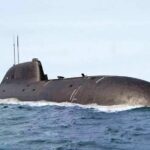 Submarine Backlog Threatens UK’s Big Bet Submarine cruising on the ocean surface