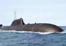 Submarine Backlog Threatens UK’s Big Bet Submarine cruising on the ocean surface
