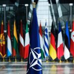 NATO Slaps Down Moscow’s Hybrid Gambit NATO flag with member country flags in the background