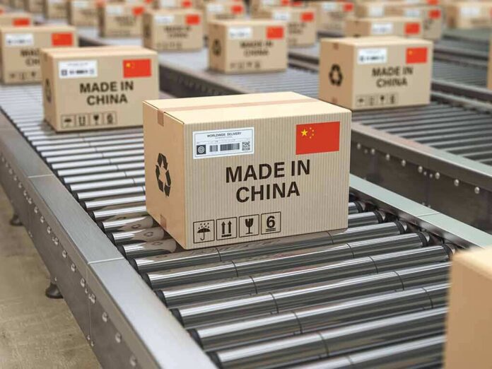shutterstock_1476229919 Cardboard boxes on a conveyor belt in a distribution center