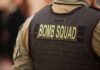 Bomb squad officer wearing tactical vest
