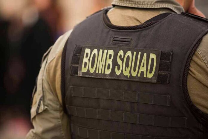 shutterstock_1493728574 Bomb squad officer wearing tactical vest