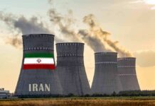 Two-Week Meltdown? Treasury Rings Iran Alarm nuclear power plant cooling towers in Iran at sunset