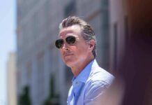 FBI File Haunts California Mega-Donors Gavin Newsom wearing sunglasses outdoors