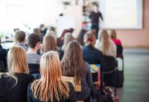 Campus Fury Over Abortion Turns Violent Students seated in a classroom listening to a presentation