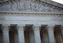 Supreme Court building facade with Corinthian columns and frieze