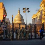 FBI Alerts Missed—Thirteen Minutes Vanished National Guard troops stand at a security fence near the U.S. Capitol