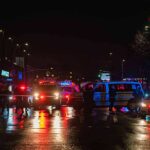 Knife Rampage Shocks Times Square Nighttime police scene with flashing lights on a wet city street