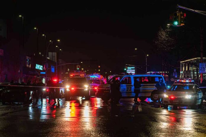 shutterstock_1903071622-2 Nighttime police scene with flashing lights on a wet city street