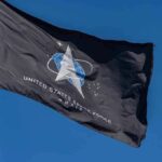 Pentagon Turbocharges Space Troops United States Space Force flag waving against a blue sky
