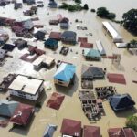 Monster Quake Triggers Tsunami Alerts Aerial view of flooded residential neighborhood
