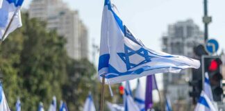 Israeli flags waved at a street demonstration