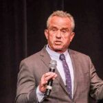 Malpractice Meltdown: RFK Jr. Takes On CNN Robert F. Kennedy Jr. speaking on stage with a microphone