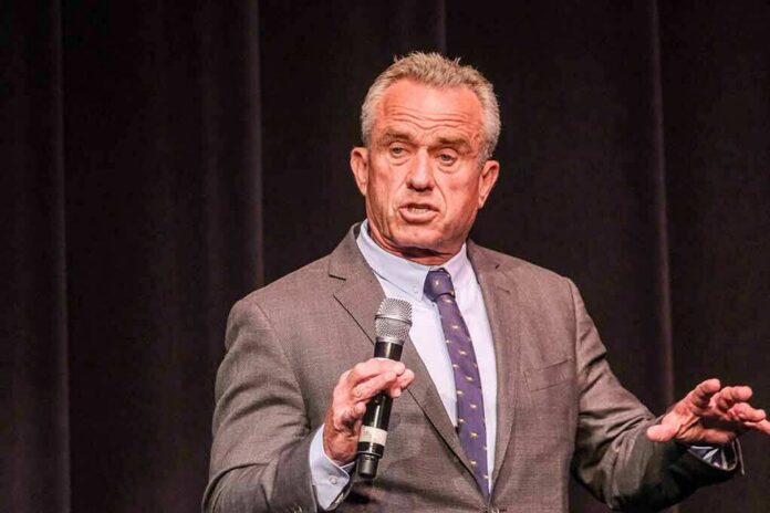 Robert F. Kennedy Jr. speaking on stage with a microphone